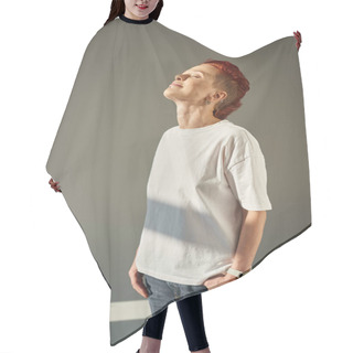 Personality  Happy And Unique Queer Person In White T-shirt And Jeans Standing In Sunlight On Grey Backdrop Hair Cutting Cape
