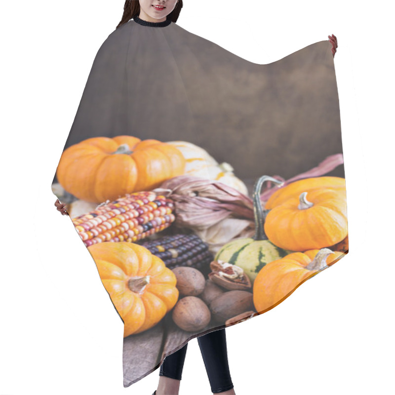 Personality  Variety of colorful decorative pumpkins on a table hair cutting cape