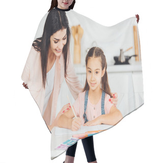 Personality  Happy Mother Standing Near Paper Near Happy Daughter Looking At Camera  Hair Cutting Cape