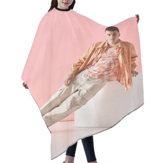 Personality  Full Length Image Of Stylish Man In Beige Shirt, Pants And Boots On White Cube On Pink Background Hair Cutting Cape