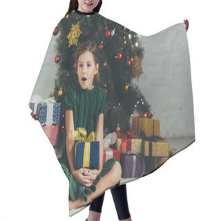 Personality  Surprised Kid Sitting On Floor Near Christmas Tree, Holding Gift Box And Looking At Camera Hair Cutting Cape