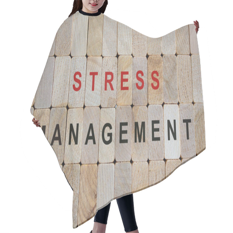 Personality  Wooden blocks form the words 'stress management'. Beautiful wooden background. hair cutting cape