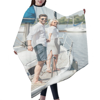 Personality  Beautiful Happy Young Couple In Sunglasses Holding Hands And Smiling At Camera On Yacht Hair Cutting Cape