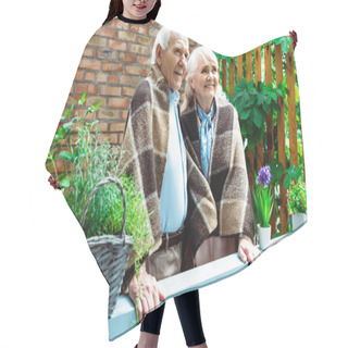 Personality  Selective Focus Of Happy Senior Wife And Husband Standing In Plaid Blankets Near Plants  Hair Cutting Cape