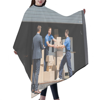 Personality  Businessman With Clipboard Standing Near Movers Holding Cardboard Boxes In Warehouse Outdoors  Hair Cutting Cape