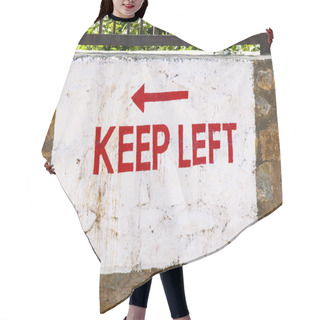 Personality  Keep Left Sign Painted At A Wall Hair Cutting Cape