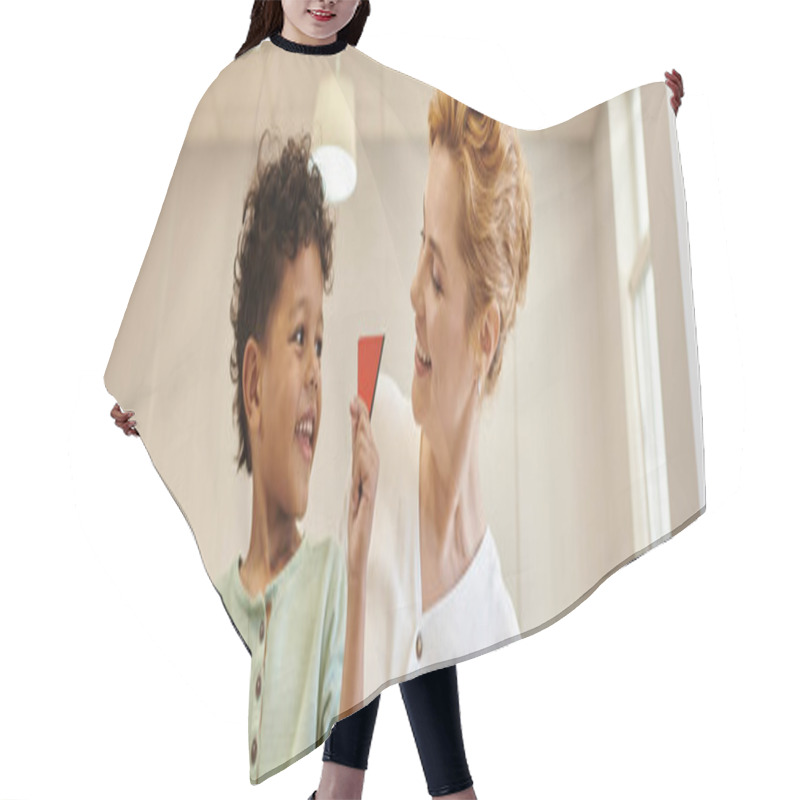 Personality  Happy African American Boy Holding Triangle Near Teacher During Lesson In Montessori School, Banner Hair Cutting Cape