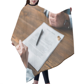 Personality  Partial View Of Lawyer And Client Sitting At Table With Divorce Decree And Wedding Rings  Hair Cutting Cape