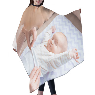 Personality  Cropped Shot Of Mother Putting Clothes On Adorable Infant Baby Lying On Sofa  Hair Cutting Cape