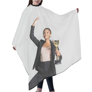Personality  Smiling African American Businesswoman Performing Ballet With Golden Cup Isolated On Grey Hair Cutting Cape