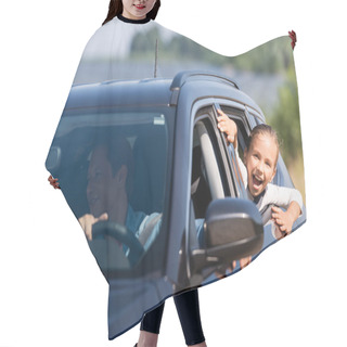 Personality  Selective Focus Of Excited Girl Looking Through Window Of Car Near Father  Hair Cutting Cape