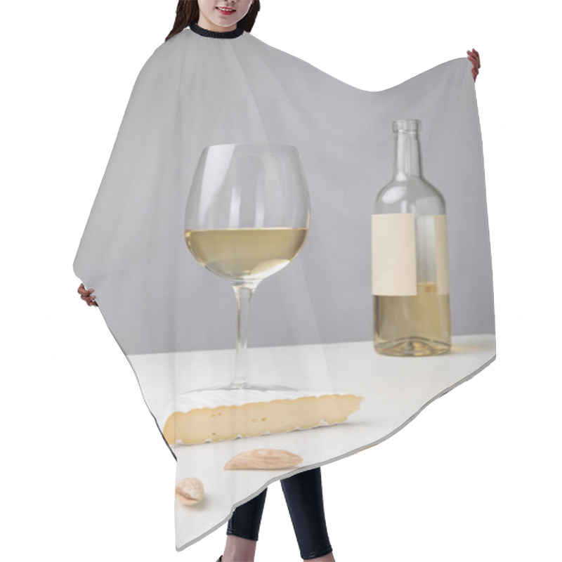 Personality  Closeup View Of Brie Cheese, Almond, Wine Glass And Bottle On Gray Hair Cutting Cape