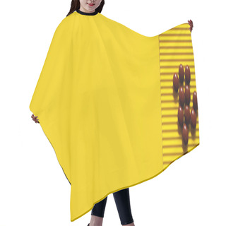 Personality  Top View Of Pile With Brown Round Shape Pills On Yellow Textured Background, Banner Hair Cutting Cape