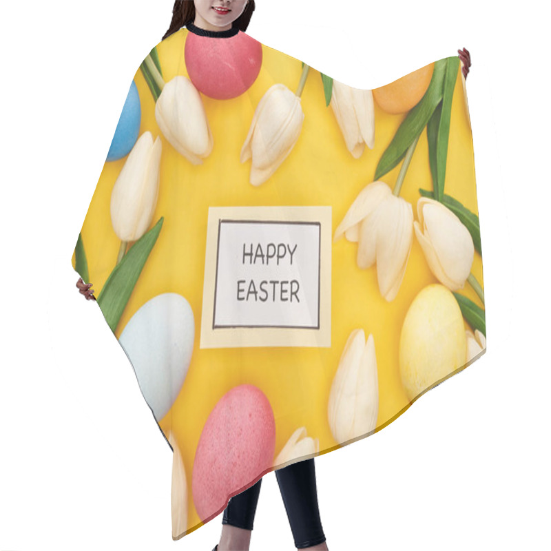 Personality  top view of tulips and painted Easter eggs around card with happy Easter lettering on colorful yellow background hair cutting cape