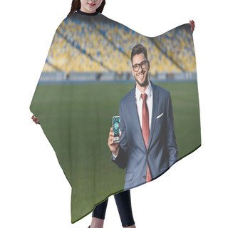 Personality  Smiling Young Businessman In Suit And Glasses Holding Smartphone With Stopwatch App At Stadium Hair Cutting Cape