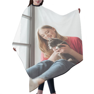 Personality  Selective Focus Of Positive Woman Holding Cute Cat While Sitting On Window Sill  Hair Cutting Cape