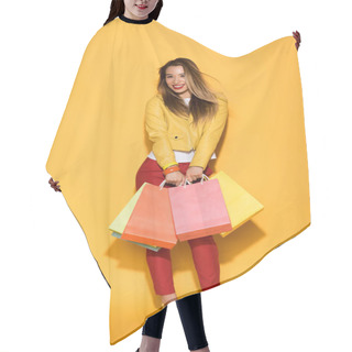 Personality  Smiling Asian Woman With Shopping Bags On Yellow Background  Hair Cutting Cape