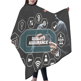 Personality  Hacker In Hood Using Smartphone And Holding Credit Card Near Quality Assurance Lettering On Black  Hair Cutting Cape