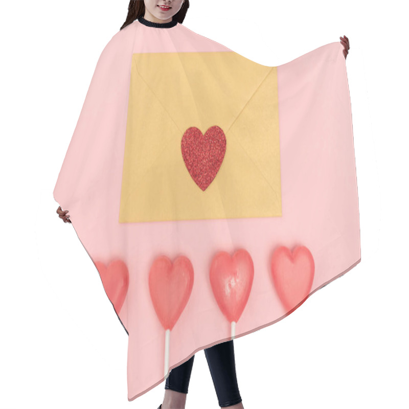 Personality  top view of heart shaped lollipops and envelope with heart on pink background hair cutting cape