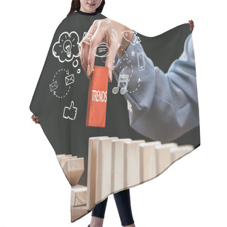 Personality  Cropped View Of Woman Picking Red Block With Word 'trends' Out Of Wooden Bricks, Icons On Foreground Hair Cutting Cape