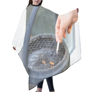Personality  Berlin, Berlin/Germany - 03.09.2019: A Hand Extinguishing A Cigarette In A Black Standing Ashtray With Handle And A Sieve Hair Cutting Cape