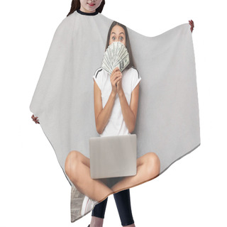Personality  Image Of Excited Shocked Young Woman Sitting Isolated Over Grey Background Using Laptop Computer Holding Money Covering Face. Hair Cutting Cape