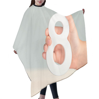 Personality  Eight In Hand. A Hand Holds A White Number 8 On A Blurred Background. Concept With Number Eight. Birthday 8 Years, Percentage, Eighth Grade Or Day, International Womens Day Hair Cutting Cape