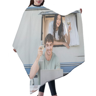 Personality  Smiling Couple Holding Vine Glasses During Video Call On Laptop Near Camper Van  Hair Cutting Cape