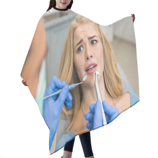 Personality  Cropped Shot Of Dentist Examining Teeth Of Frightened Female Client Hair Cutting Cape