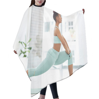 Personality  Yoga Is All About Balance. Full Length Shot Of An Attractive Young Woman Practising Yoga In The Studio And Holding A High Lunge Pose. Hair Cutting Cape