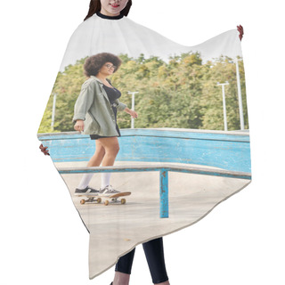 Personality  Young African American Woman With Curly Hair Rides A Skateboard Fearlessly On A Metal Rail At An Outdoor Skate Park. Hair Cutting Cape