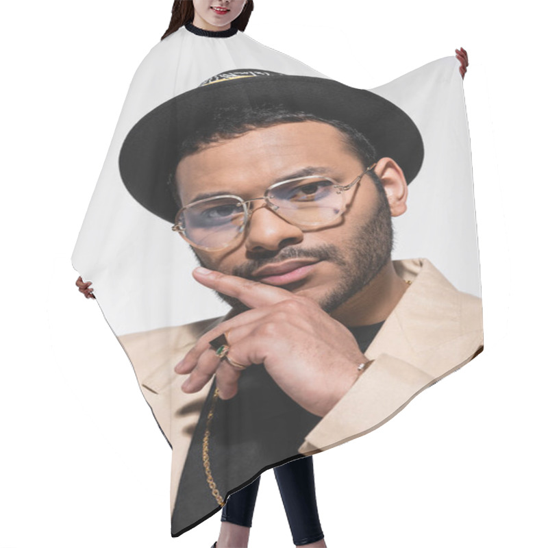 Personality  Portrait Of Stylish Indian Hip Hop Performer In Fedora Hat And Eyeglasses Isolated On Grey Hair Cutting Cape