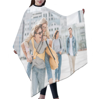 Personality  Happy Couple Having Fun And Piggybacking In City With Friends Behind Hair Cutting Cape