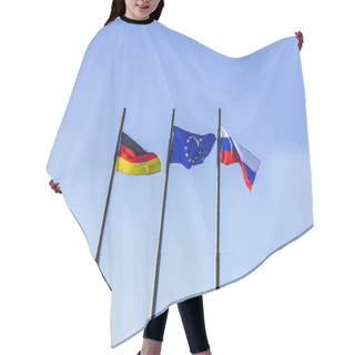 Personality  Flags Of Three Countries:  Germany, Russia And The European Union Against The Blue Sky Background.  Hair Cutting Cape