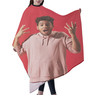 Personality  Confused African American Man In Gym Clothes Gesturing With Opened Mouth On Red Background Hair Cutting Cape