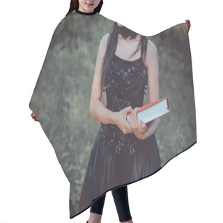 Personality  Cropped View Of  Woman In Witch Costume Standing On Forest Background With Red Book Hair Cutting Cape
