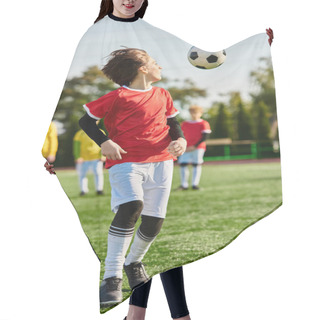 Personality  A Spirited Young Boy Energetically Plays Soccer On A Grassy Field, Skillfully Dribbling The Ball Past Imaginary Opponents With Focused Determination. Hair Cutting Cape