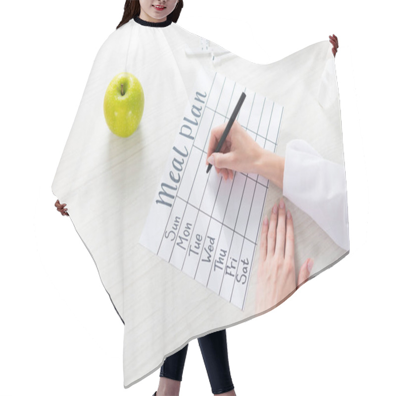Personality  Cropped View Of Dietitian Writing In Meal Plan At Table With Fruits Hair Cutting Cape