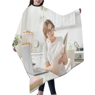 Personality  Middle Aged Woman Engrossed In A Book At A Cozy Kitchen Table. Hair Cutting Cape