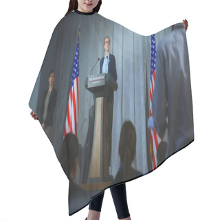 Personality  US Presidential Candidate Makes An Announcement, Answers Media Questions, Gives Interview. Female American Republican Politician During Performance At Press Conference. Backdrop With American Flags. Hair Cutting Cape