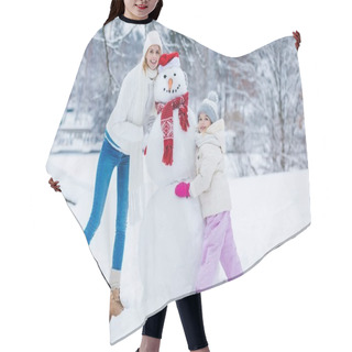 Personality  Happy Mother And Daughter Standing Near Snowman Together In Winter Forest Hair Cutting Cape