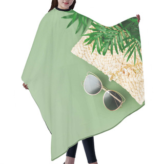 Personality  Tropical Leaves And Beach Bag With Sunglasses On Green Background. Top View, Flat Lay. Hair Cutting Cape