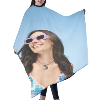 Personality  A Stunning Woman Wearing A Bathing Suit And Stylish Sunglasses Poses Against A Blue Background, Exuding Summertime Vibes. Hair Cutting Cape