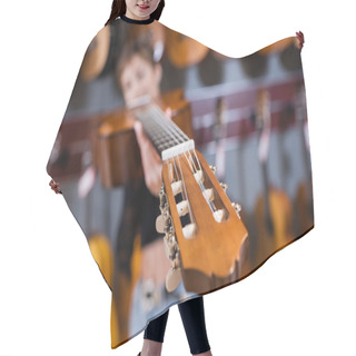 Personality  Acoustic Guitar And Blurred Customer In Music Shop  Hair Cutting Cape