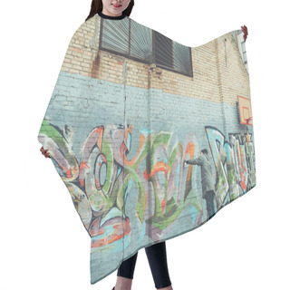 Personality  Low Section View Of Man Painting Colorful Graffiti On Building Hair Cutting Cape