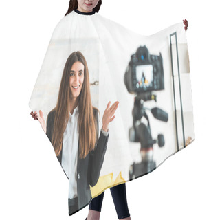 Personality  Selective Focus Of Happy Video Blogger Gesturing While Looking At Digital Camera  Hair Cutting Cape