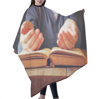 Personality  Low Key Image Of Person Sitting Next To Prayer Book Hair Cutting Cape