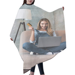 Personality  Happy Beautiful Woman Holding Credit Card In Hand And Sitting On Sofa With Laptop  Hair Cutting Cape