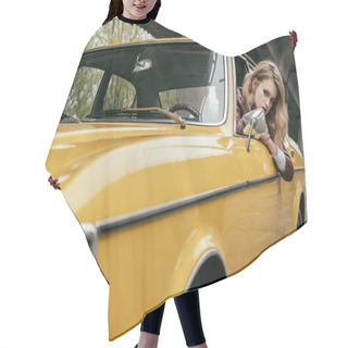 Personality  Attractive Young Woman Looking At Camera While Sitting In Yellow Vintage Car Hair Cutting Cape