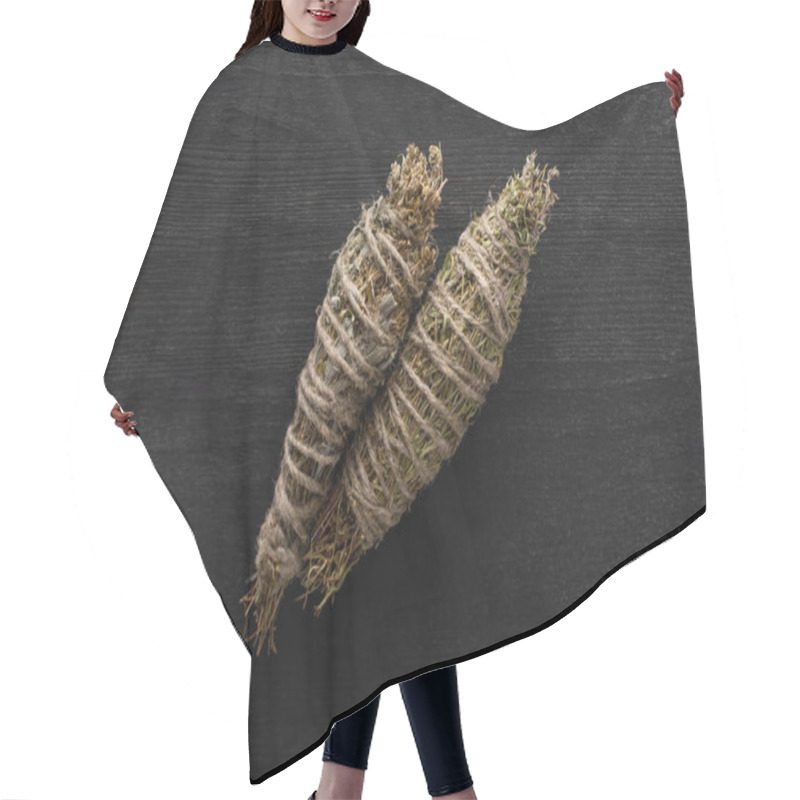 Personality  Top view of herbal smudge sticks on dark wooden background hair cutting cape